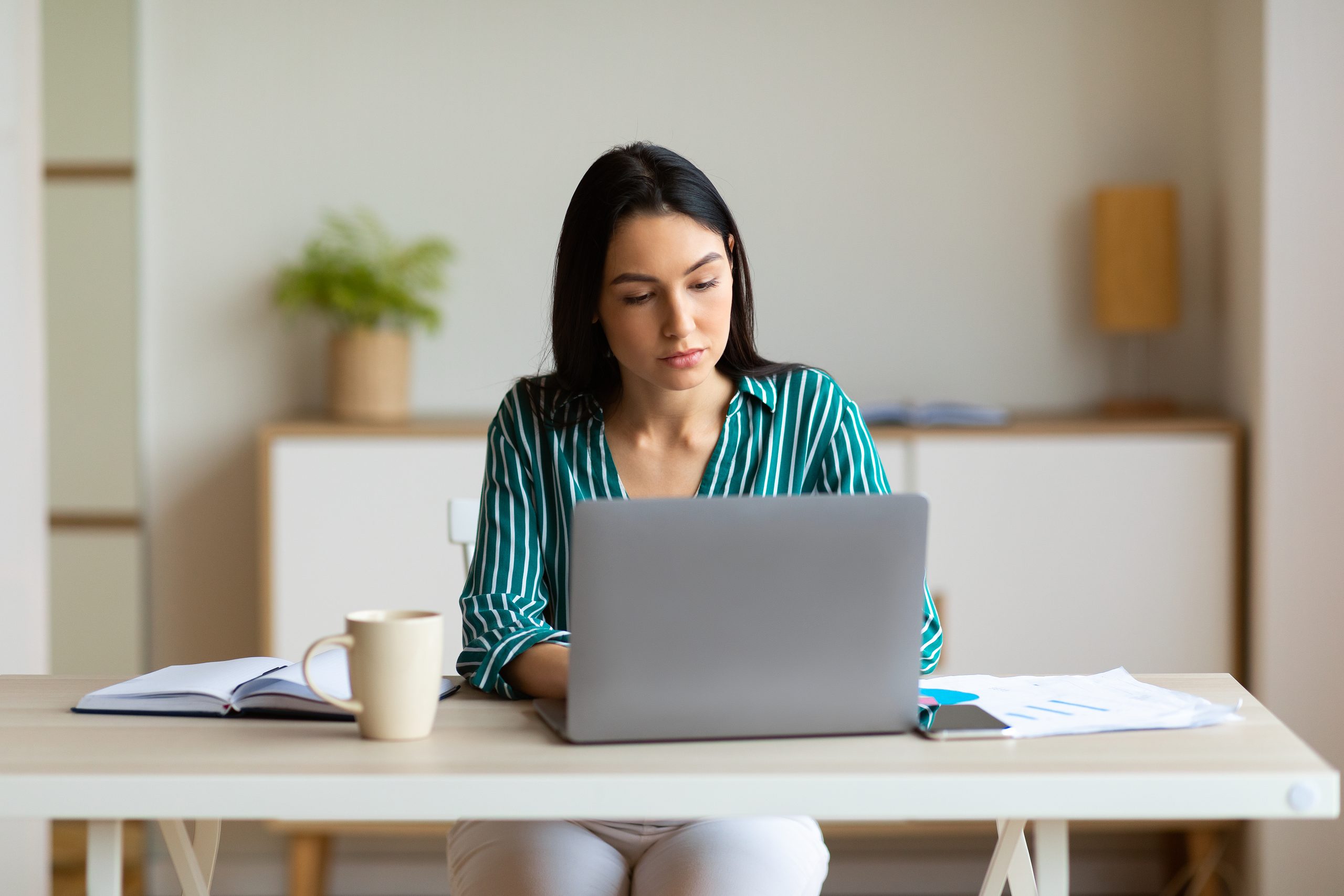 A specialist structuring answer-ready content on a tablet