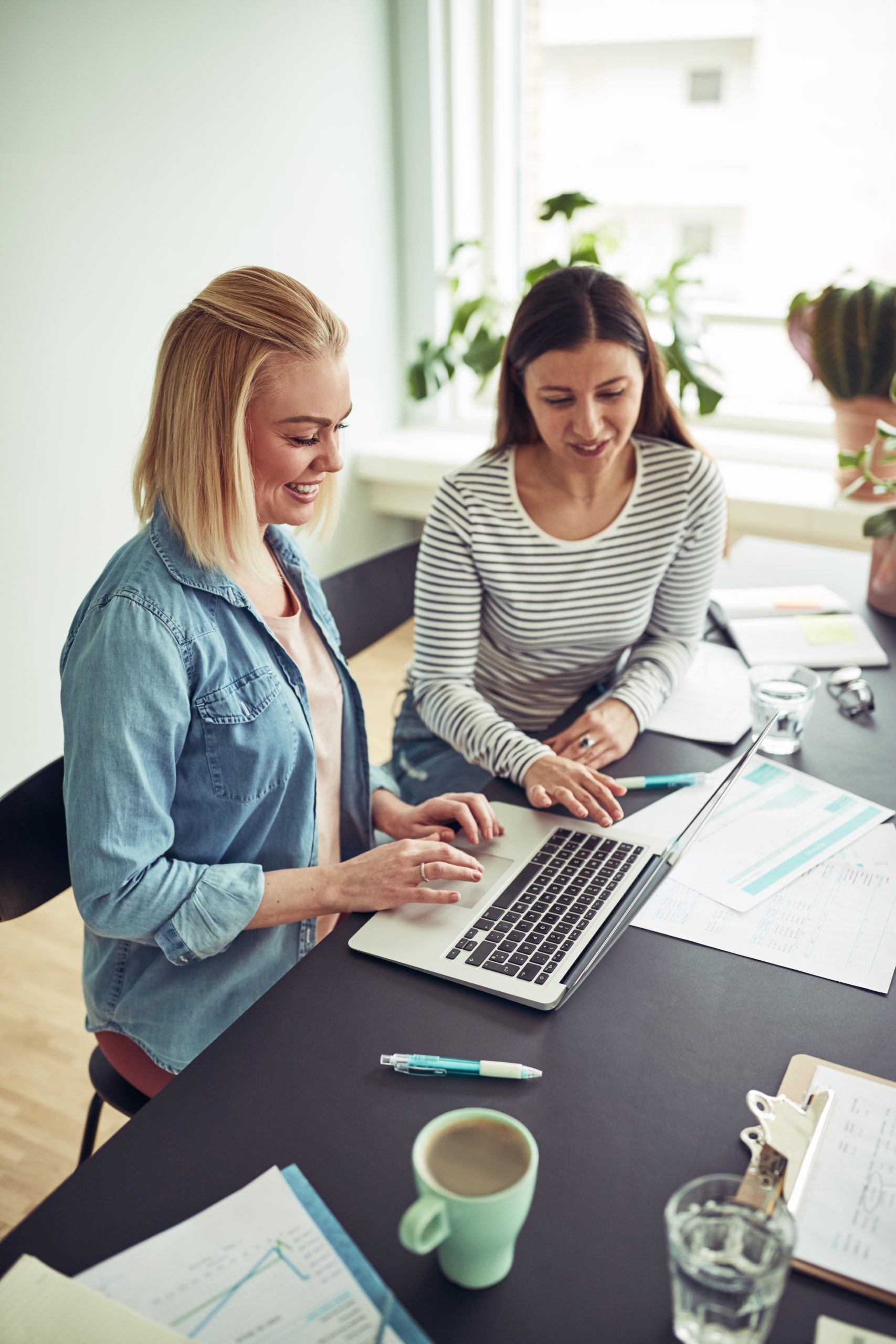 Reviewing social media reporting on a laptop